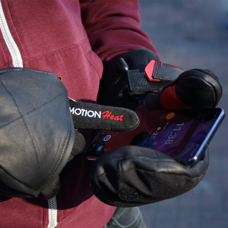 Using a phone through the flip-open mitten with touchscreen heated glove liner fingertips